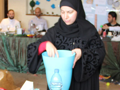  trainer Jawaher Al-Mane’ helping the trainees and distribute the balls on them