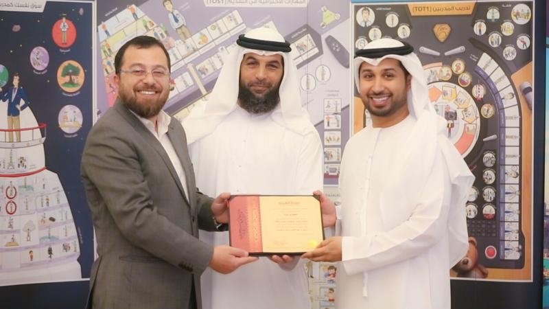 Dr. Mohammed, trainer Faisal, and Mr. Salem at the conclusion ceremony and awarding of certificates